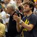 Former Michigan basketball player Zack Novak claps for Michigan while standing behind the bench during the second half at Breslin Center in East Lansing on Tuesday, Feb. 12. Melanie Maxwell I AnnArbor.com